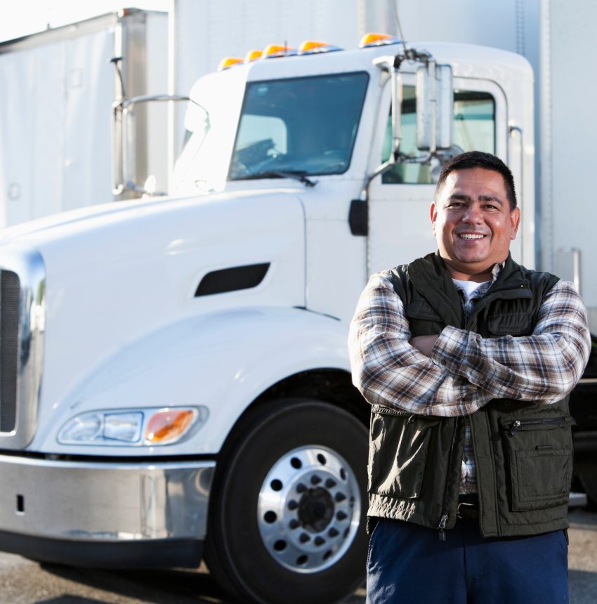 Man Standing in Front of Truck Smiling